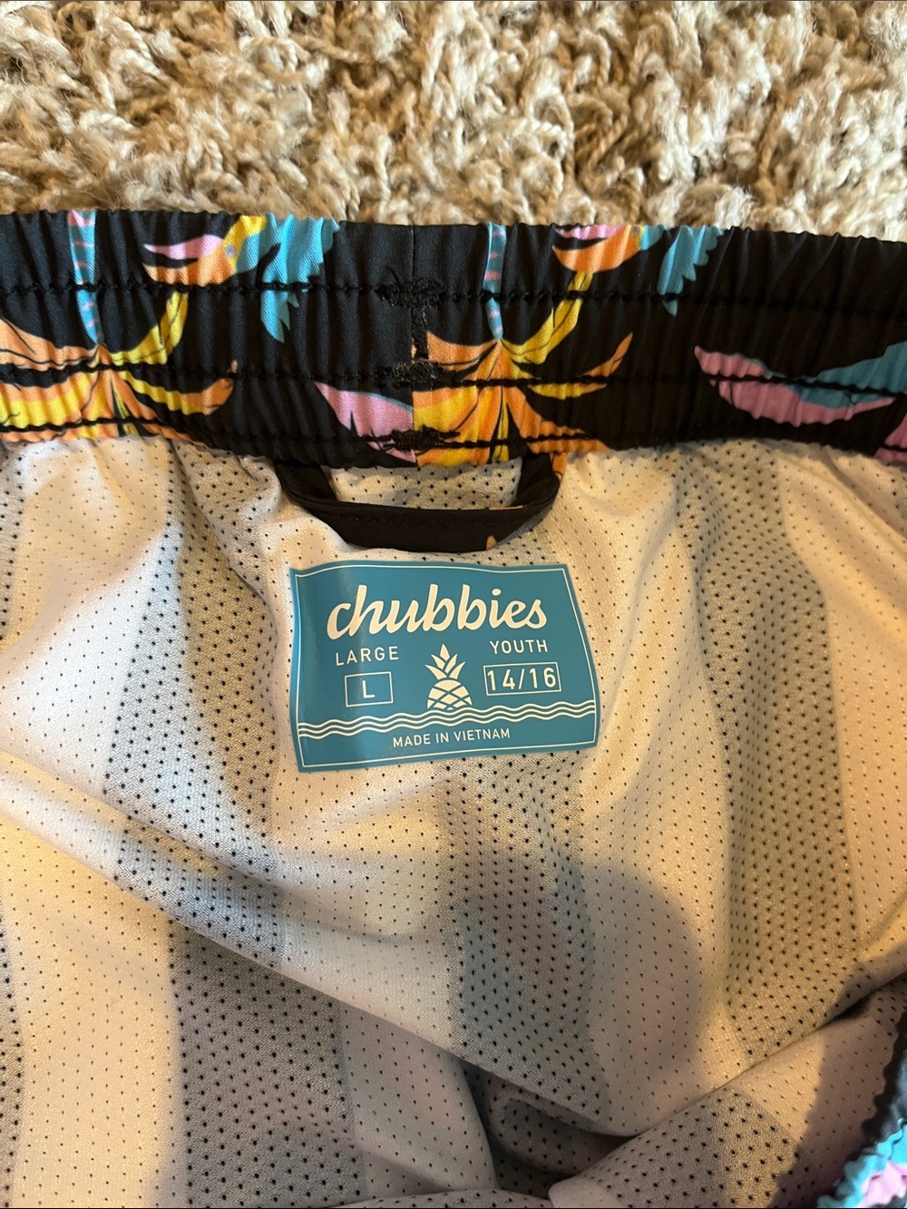 Chubbies youth large swim trunks with colorful palm tree print. - Picture 3 of 3